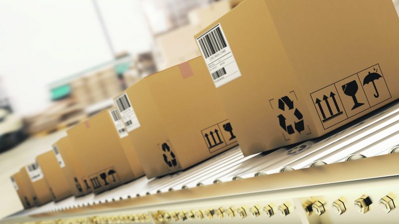 Packed,Courier,On,Production,Line,Against,Cardboard,Boxes,In,Warehouse, e-commerce
